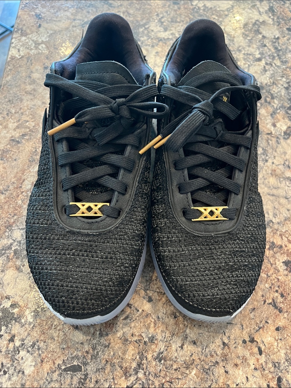 Nike Women's Black Knit Athletic Sneakers with Gold Accents